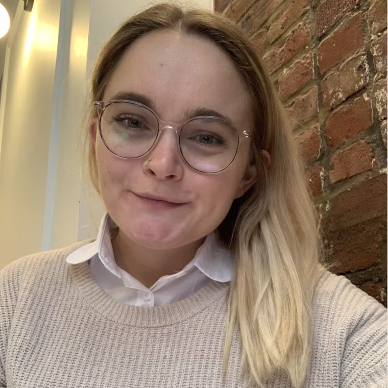 Writer Emma Stessman wears the Kalkehay Detachable Dickey Collar under a sweater.