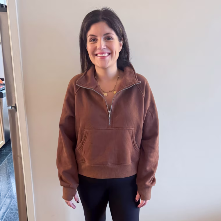 Shop TODAY editorial director Adrianna Brach at home in the Crz Yoga Butterluxe High-Waisted Leggings in Black and the Automet Half Zip Cropped Pullover Sweatshirt in Brown.
