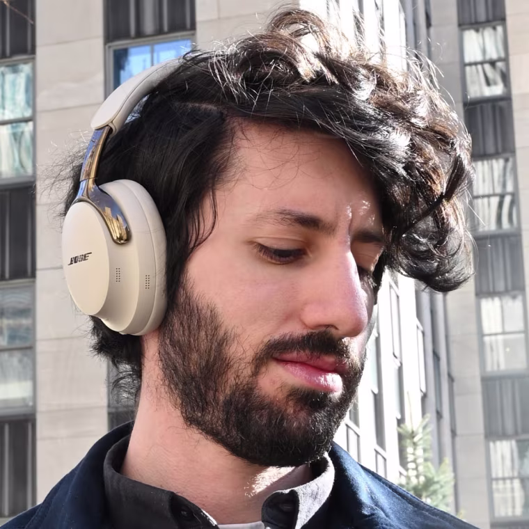 Close up, in-profile shot of the Bose QuietComfort Ultra headphones worn by the writer.