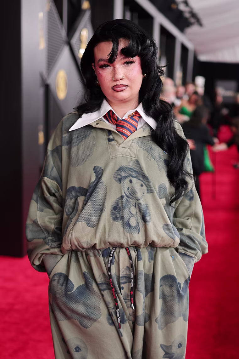 Lola Young poses for a photo on the red carpet at the Grammys.