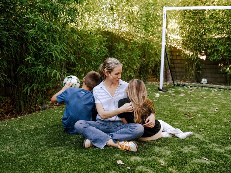 Julie Frumin and her two children, who are in 3rd grade and 6th grade, at their home in Thousand Oaks, Calif., on Feb. 5, 2026.