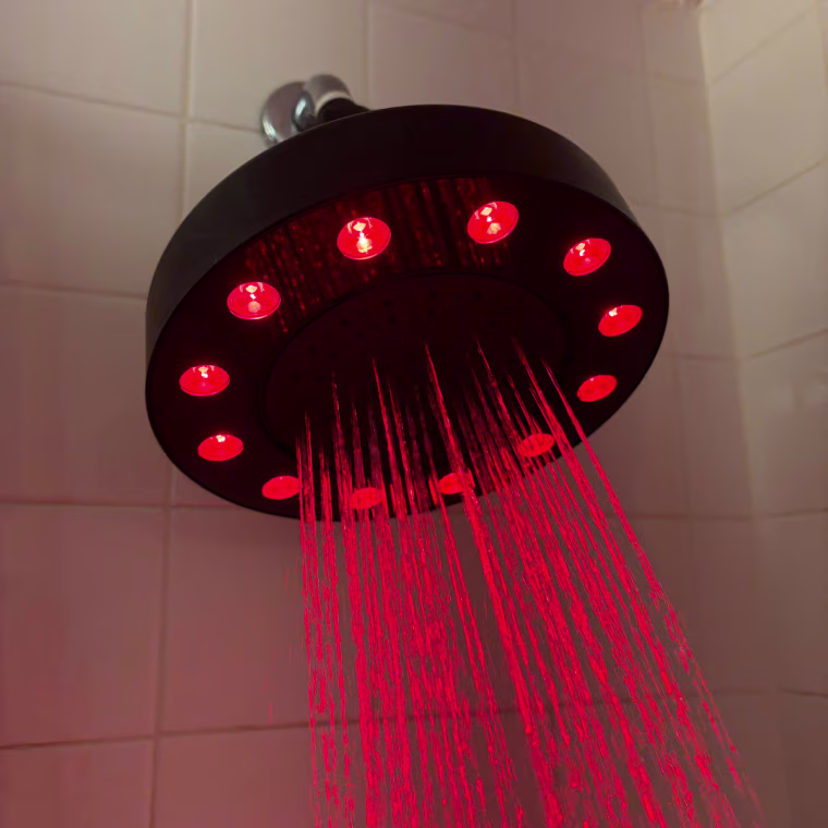 Running showerhead with red light ring