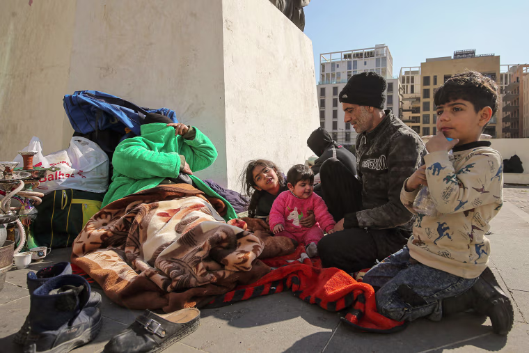 03 March 2026, Lebanon, Beirut: A family takes refuge in downtown Beirut on March 3,m 2026, after fleeing their home in the city's southern suburbs. 