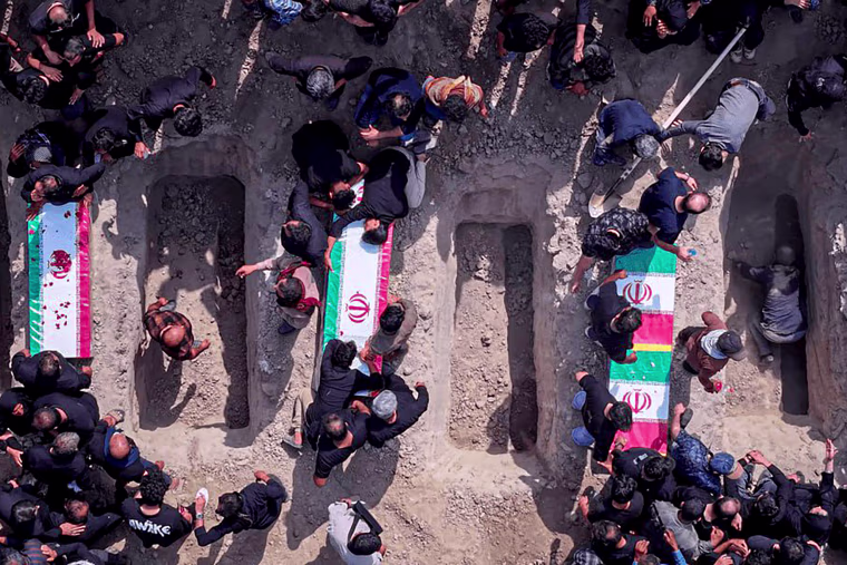 Iran holds a funeral ceremony for students and staff members of the Shajareh Tayyebeh girls' elementary school.