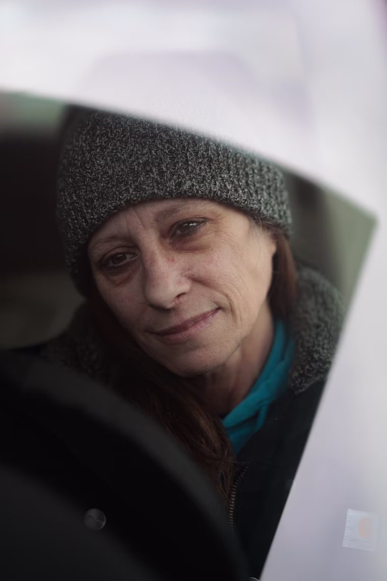 Kim Schaffner is seen from inside her car window