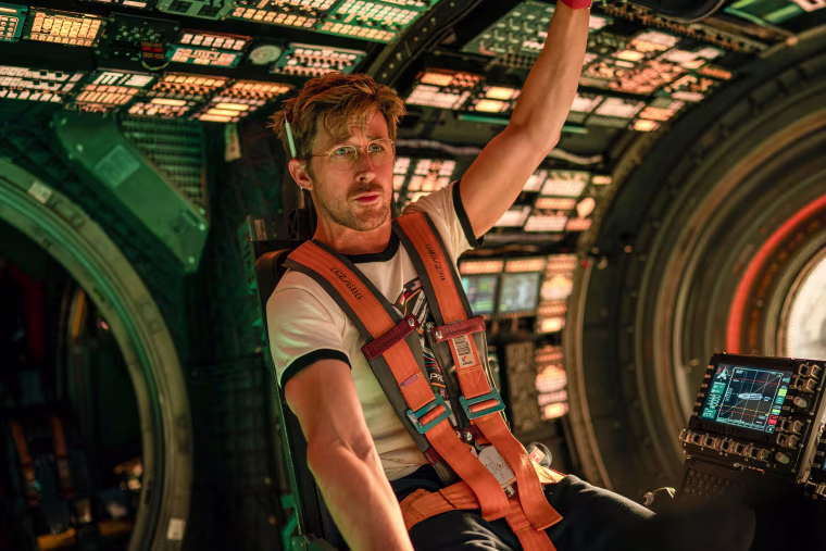 Ryan Gosling inside of a spacecraft cockpit