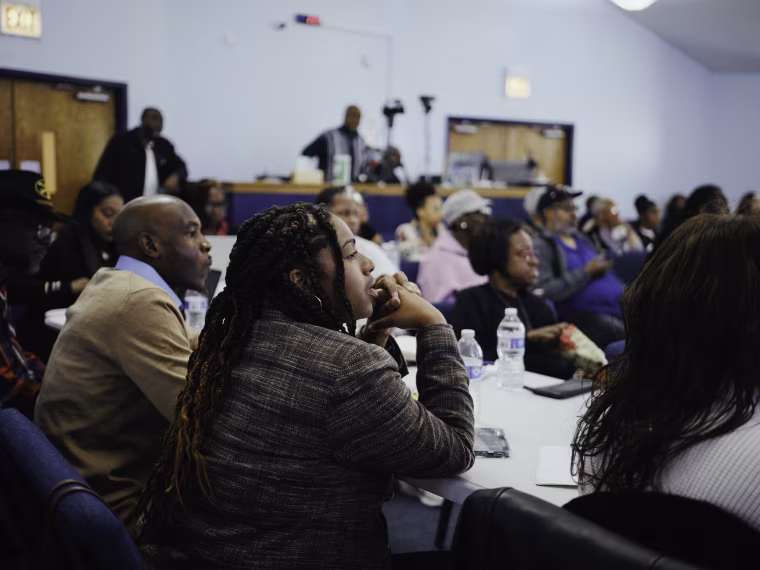Church members listen to Michelle Renee's crypto presentation at church.
