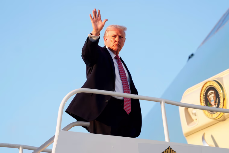 Donald Trump waves from a plane