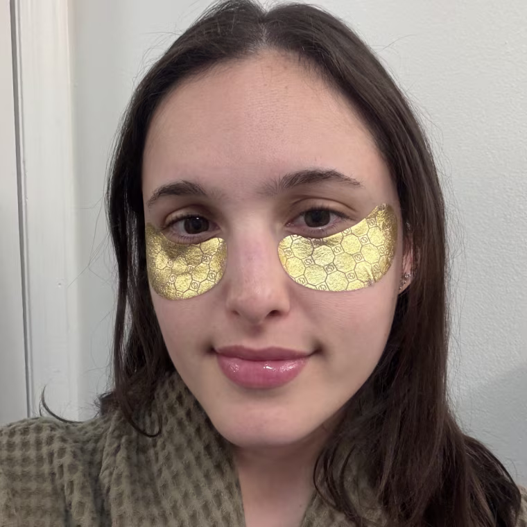 Woman wearing yellow under-eye masks