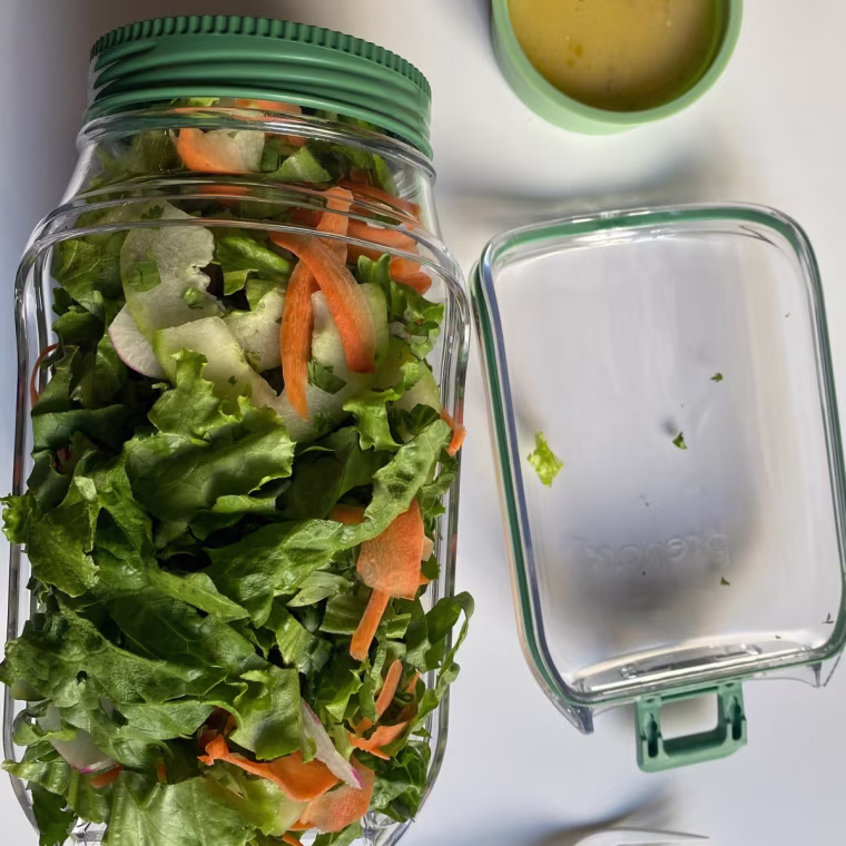 Image of Prapara the salad pod on a work table with a fork.
