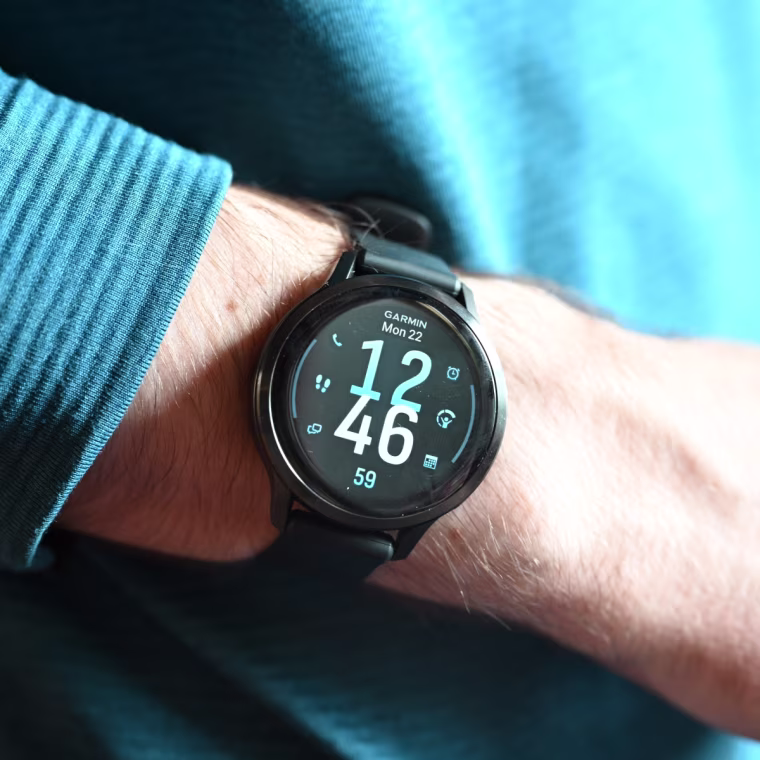 A close-up image of an Apple Watch Series 11 on the wrist of the writer.