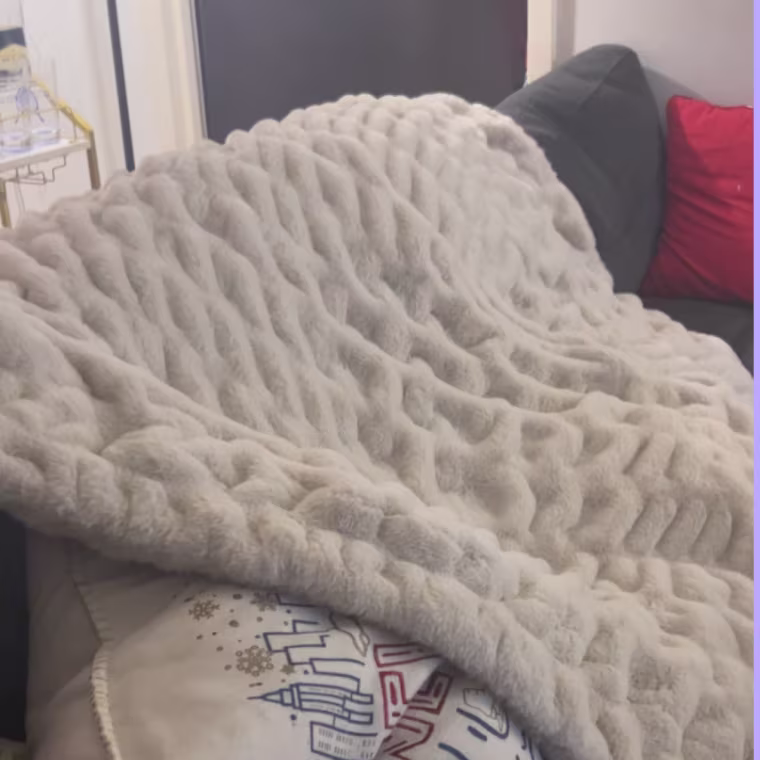 Throw blanket draped over couch