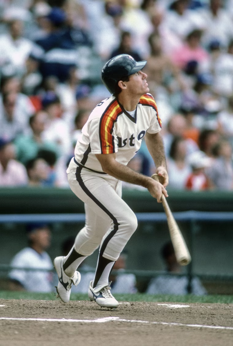 Phil Garner looks up while dropping a baseball bat.