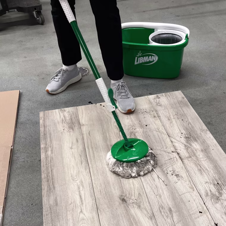 The microfiber-made mop head traps dirt and grime from the floor.