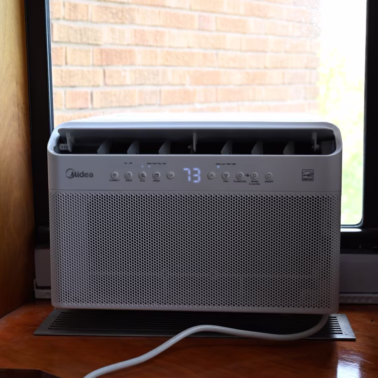 A picture of the Midea U-shaped AC in the window of NBC Select writer Harry Rabinowitz.