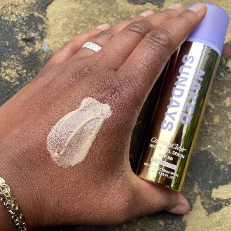 Woman with swatch of sunscreen on hand