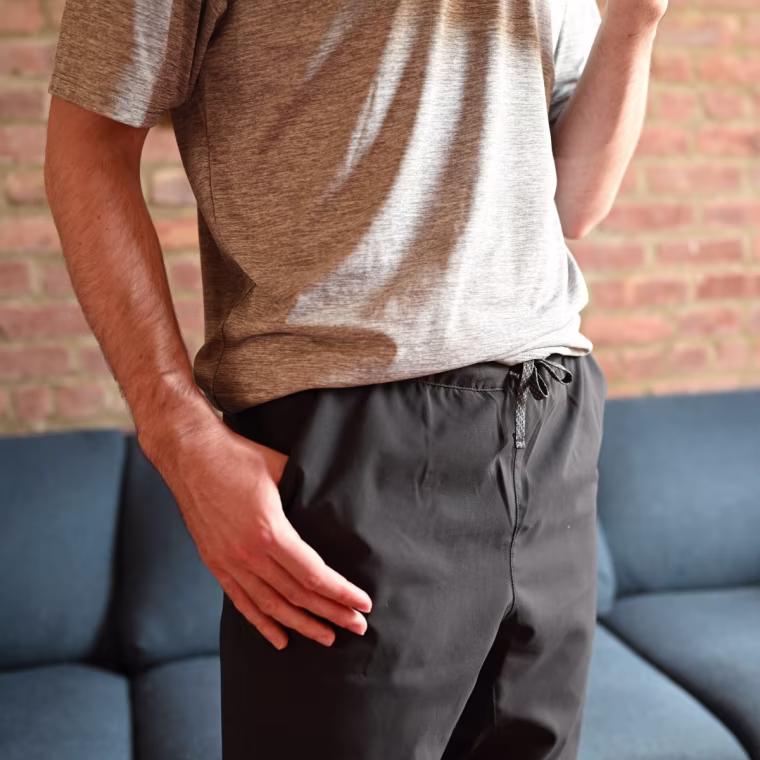 A close up of a man wearing the Patagonia Men's Terrebonne Joggers in black.