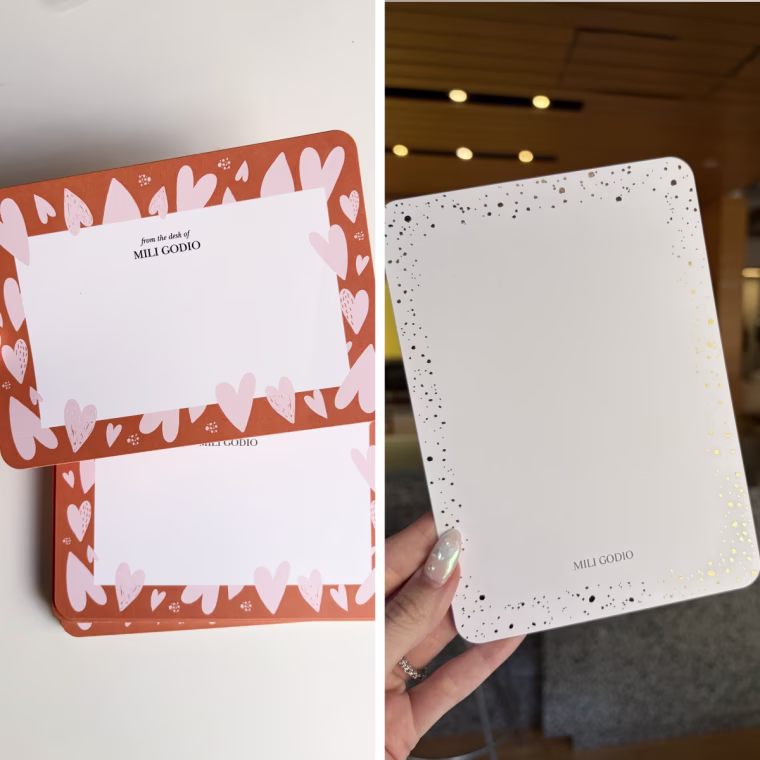 Woman holding two styles of note cards