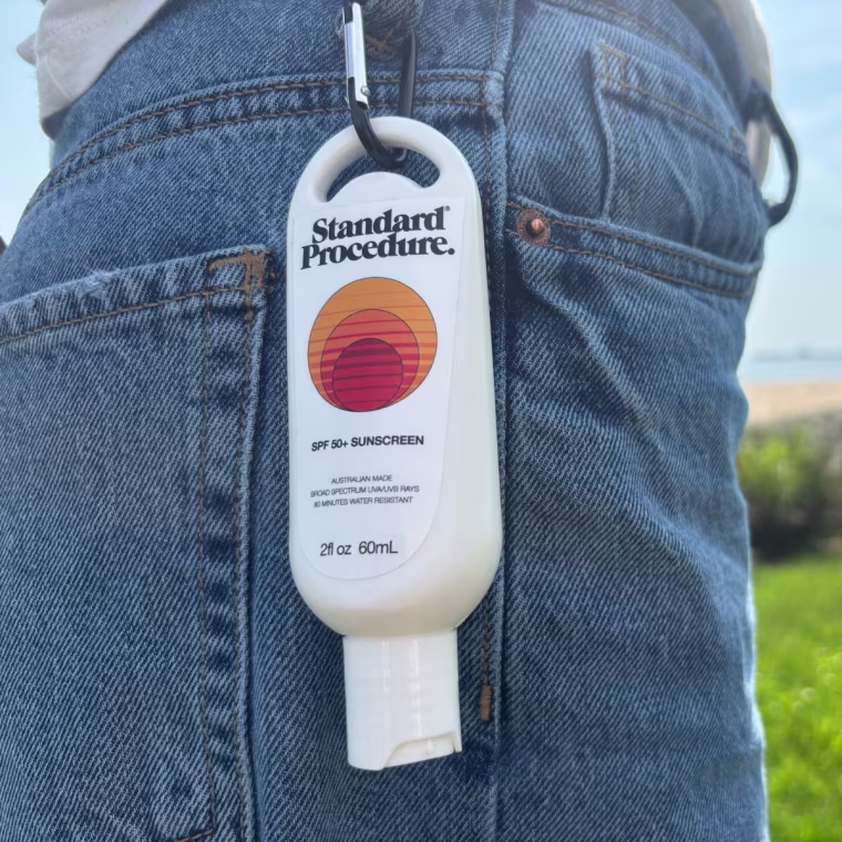 Sunscreen clipped to woman’s jeans