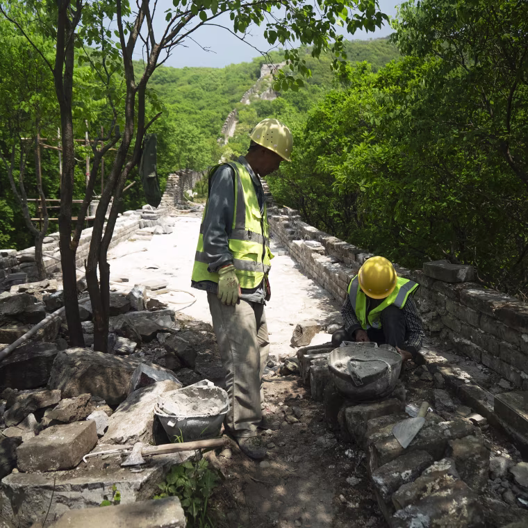 Construction workers at Phase 5 of the Great Wall reconstruction in Jiankou, China on Tuesday.
