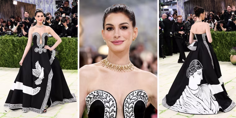 Anne Hathaway arrives in a hand-painted Michael Kors gown.