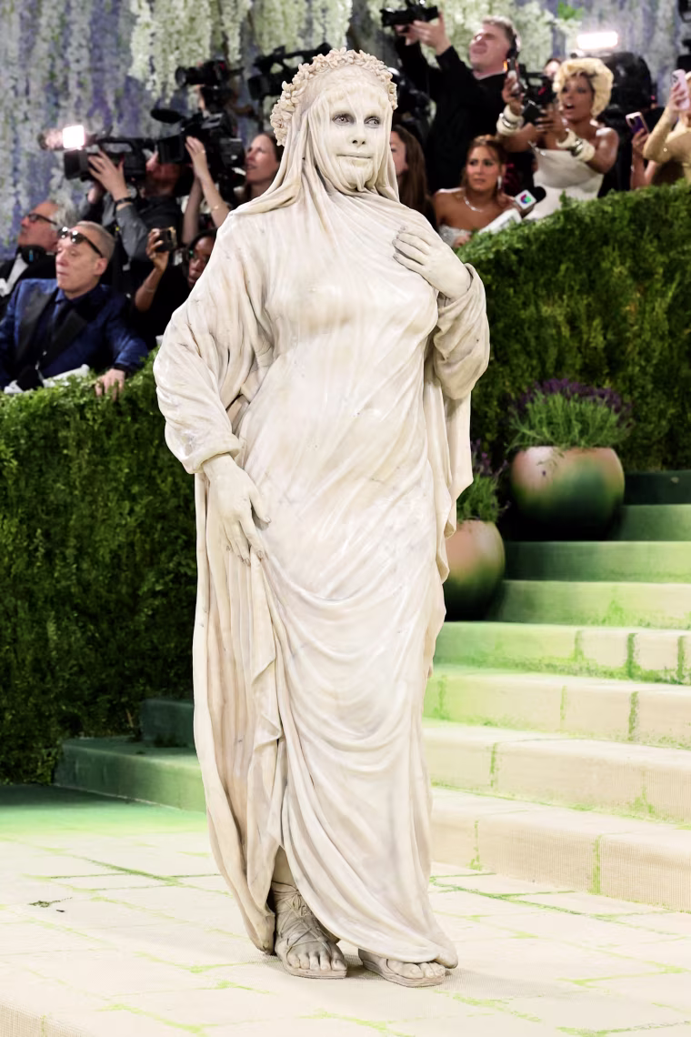 Heidi Klum dressed as a marble statue.