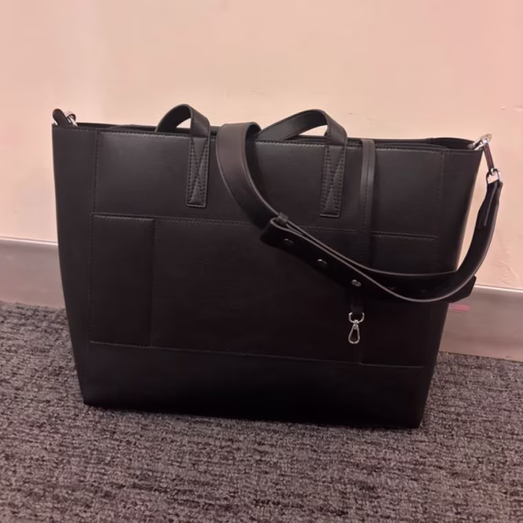 Calpak Haven Tote on the ground.