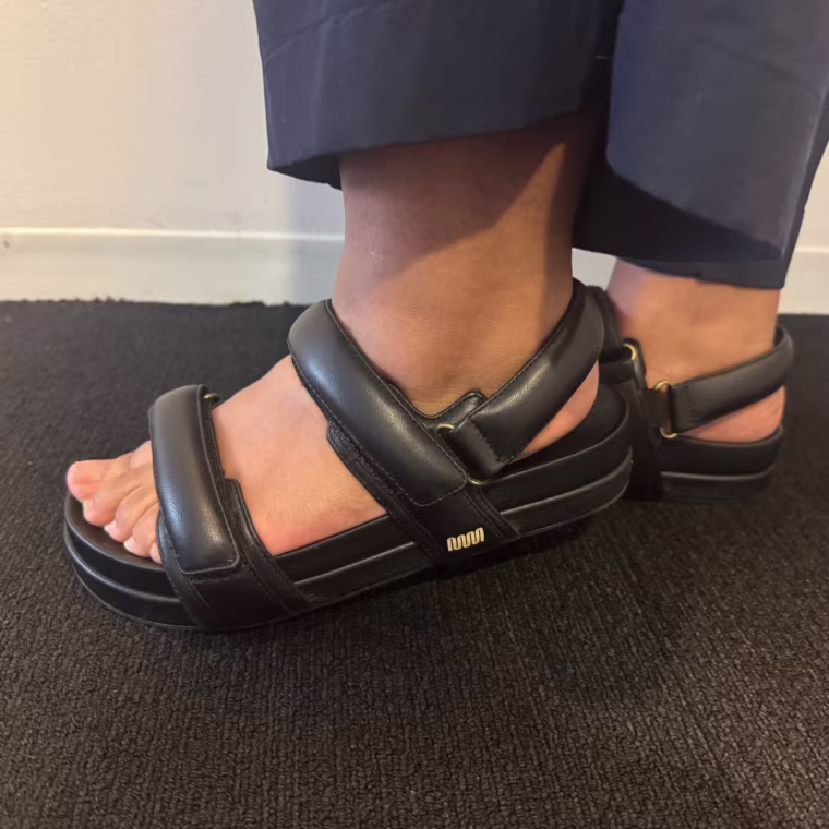 Person wearing Slingback sandals.