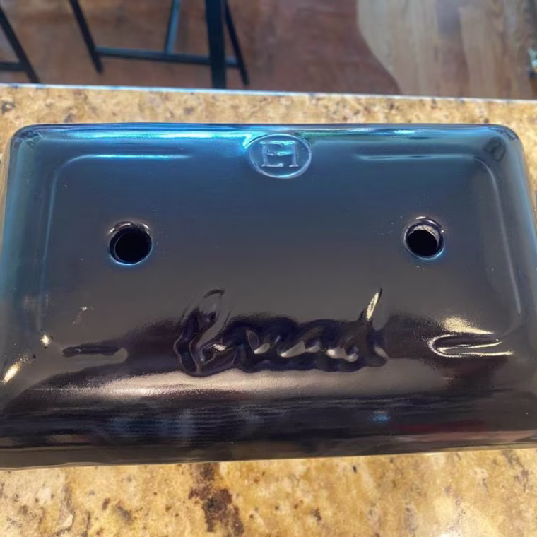 Emile Henry loaf pan sitting on a countertop