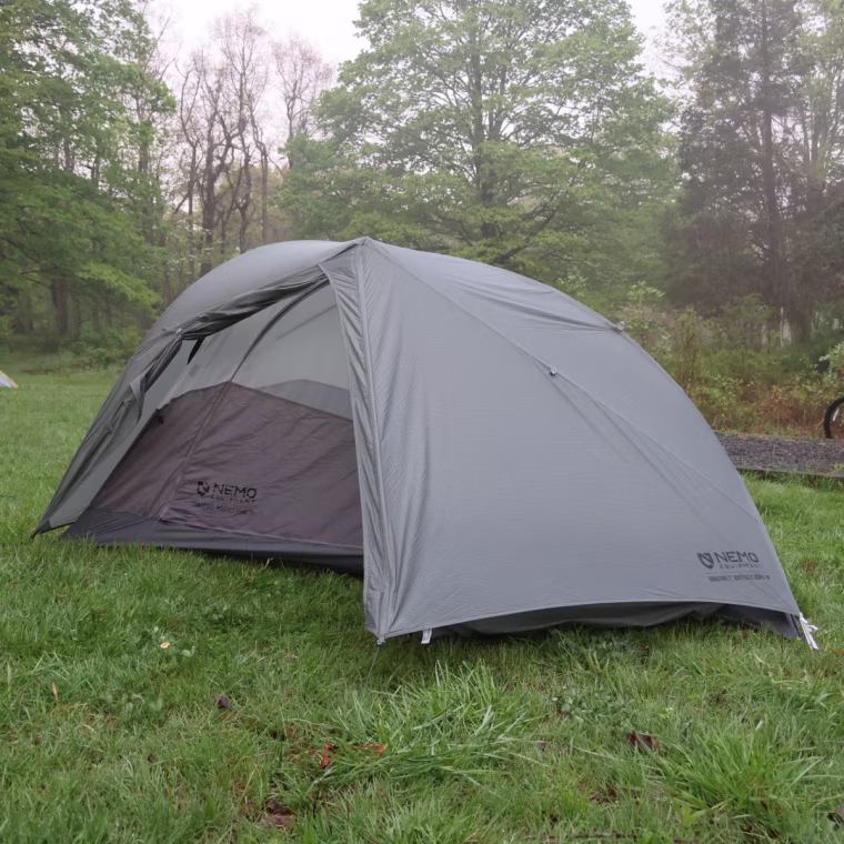 The Nemo Dragonfly Bikepack OSMO 1-Person Tent set up in a grassy field.