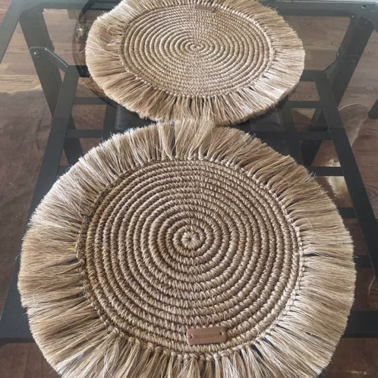 A fringe placemat on a dining room table