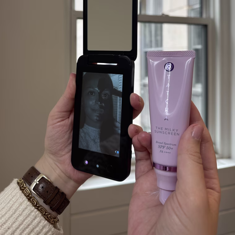 Before (left) and after (right) application of Tatcha's The Milky Sunscreen SPF 50 through a UV camera