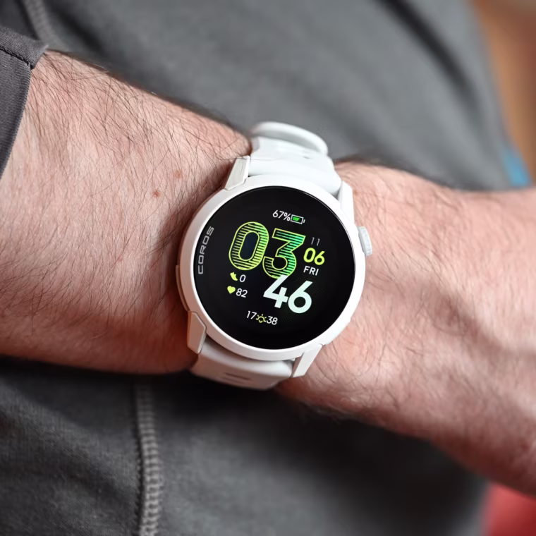 A close up of the Coros Pace 4 in white on the wrist of the writer.