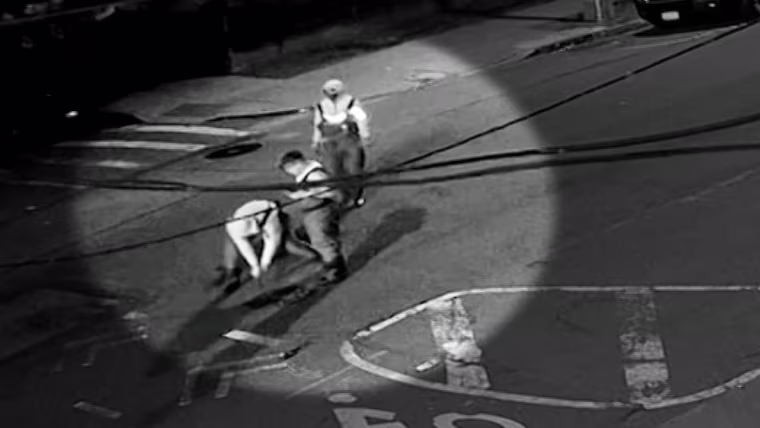 New video shows a group wearing hip waiters and carrying flash lights as they pry open a manhole cover on May 5th just before 2 a.m. in Astoria.