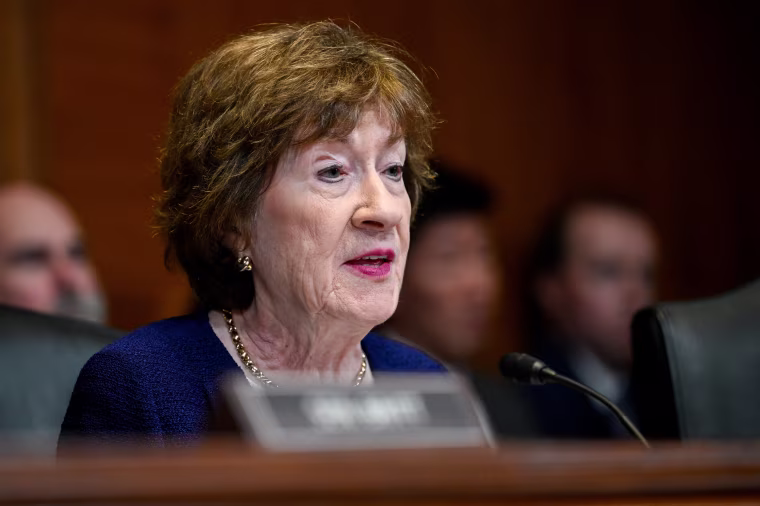 Susan Collins speaks while seated during a hearing