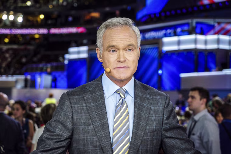 Scott Pelley seated on set