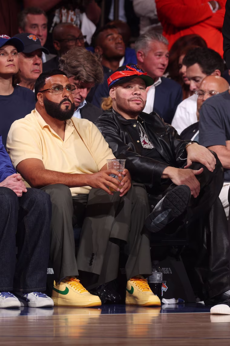 DJ Khaled and Fat Joe sit courtside.