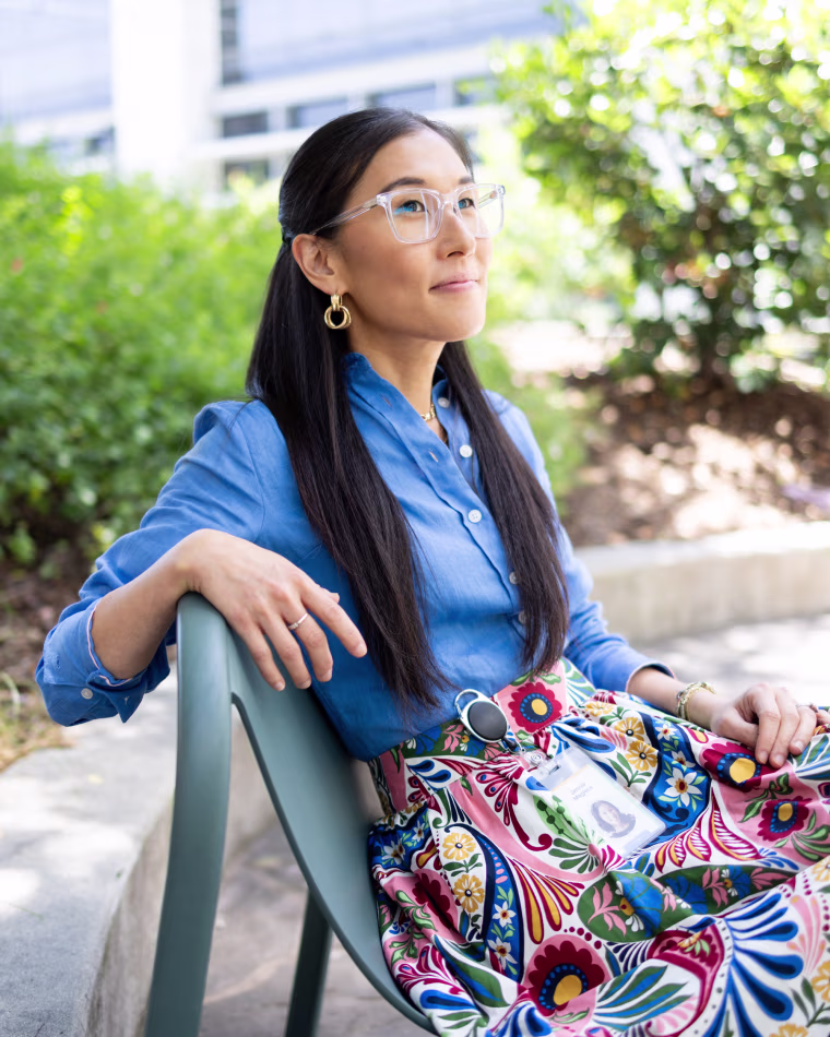 Jennie Magiera sits on a chair outside