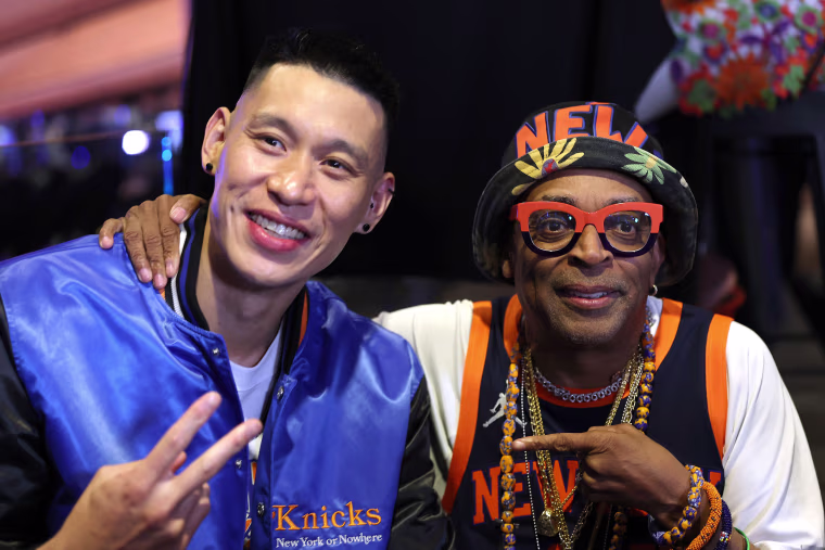 Jeremy Lin and Spike Lee hold up peace signs.