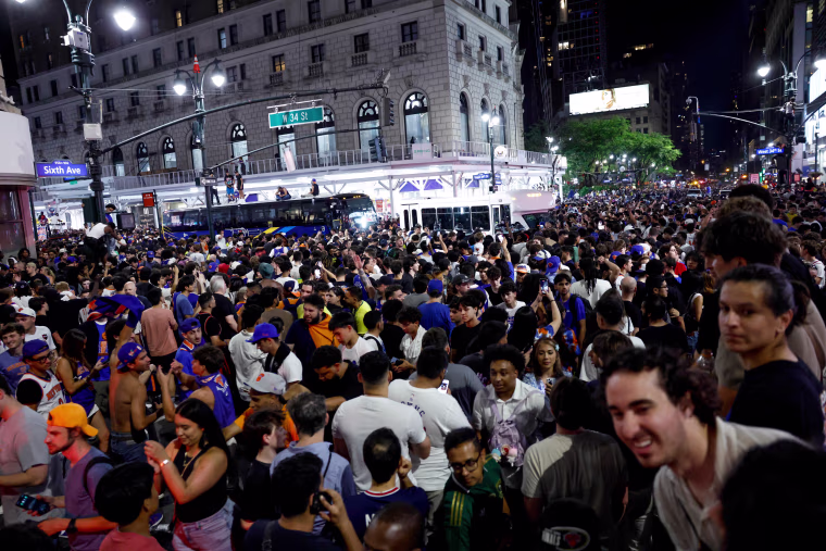 Knicks fans fill the street celebrating after the New York Knicks defeated the San Antonio Spurs in Game 5 of the NBA Finals.