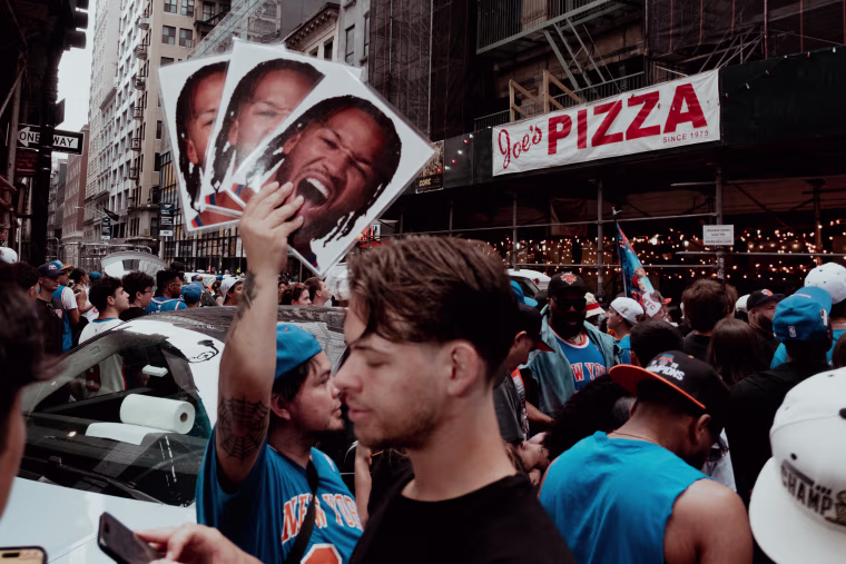Fans crowd Fulton Street in celebration of Knicks’ NBA championship.