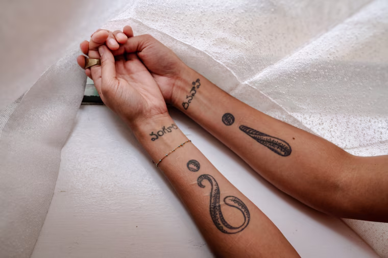 Veena's tattoos, which she got after leaving Real Love.