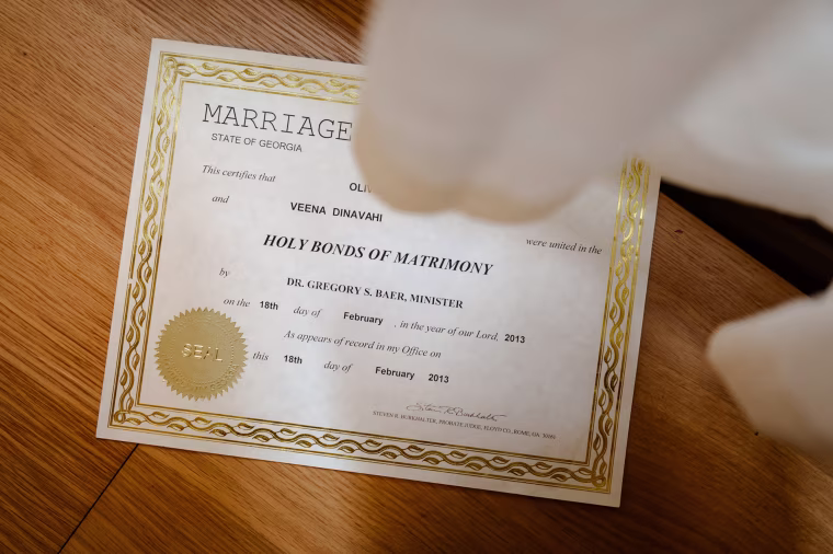 Veena's marriage certificate to her former husband, officiated by Greg Baer.