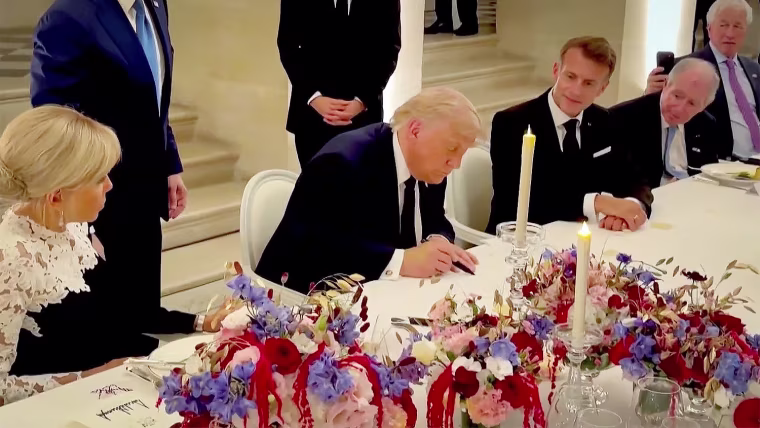 Donald Trump signs Iran deal at Versailles.
