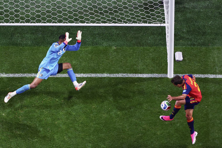 Mikel Oyarzabal shoots toward the goal during a world cup match.