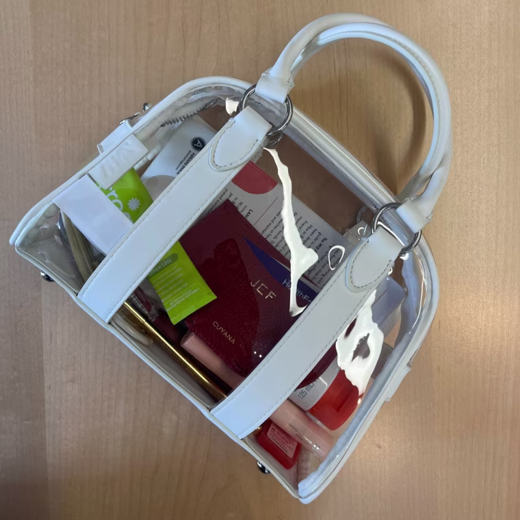 This clear bag also comes with a strap to wear as crossbody.