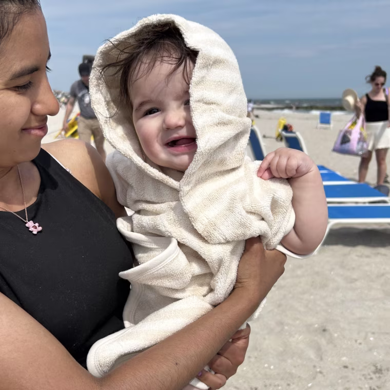 Warm and cozy for the baby, straight out of the water and into this Poncho towel