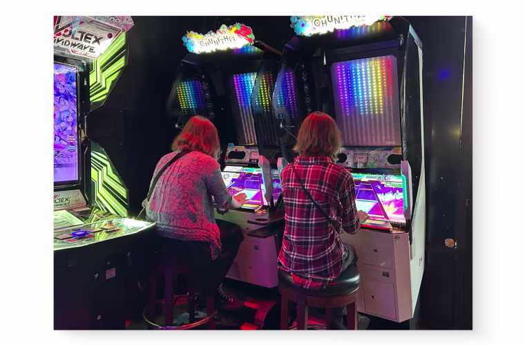 Emi and May at the arcade.