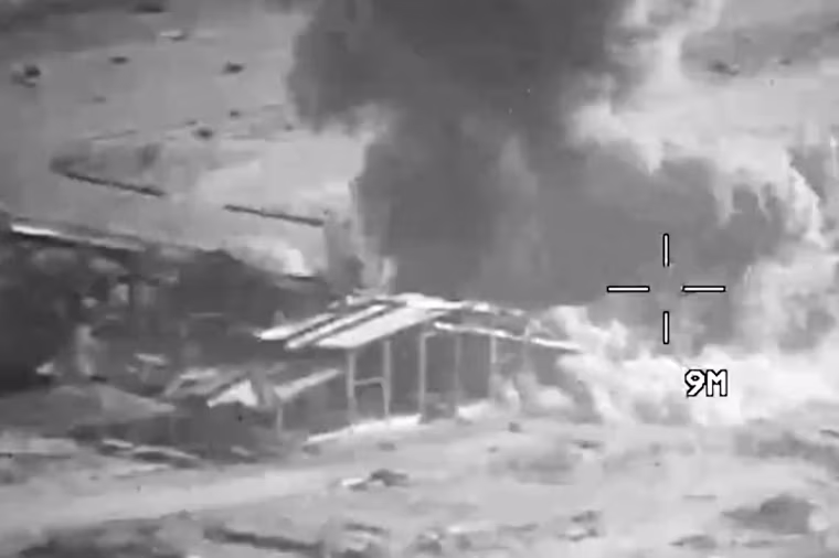 Smoke rises from an explosion at an unknown location, during U.S. strikes on Iranian military targets, in this screengrab taken from a Central Command video released Thursday.
