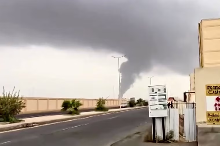 A plume of smoke rises in Jizan, Saudi Arabia, as Yemen's Iran-aligned Houthis said Saturday they carried out operations targeting Saudi Aramco facilities.